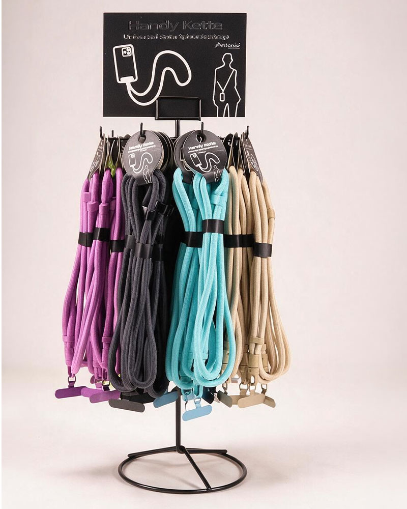 Drehdisplay mit farbigen Handyketten in Violett, Anthrazit, Türkis und Beige